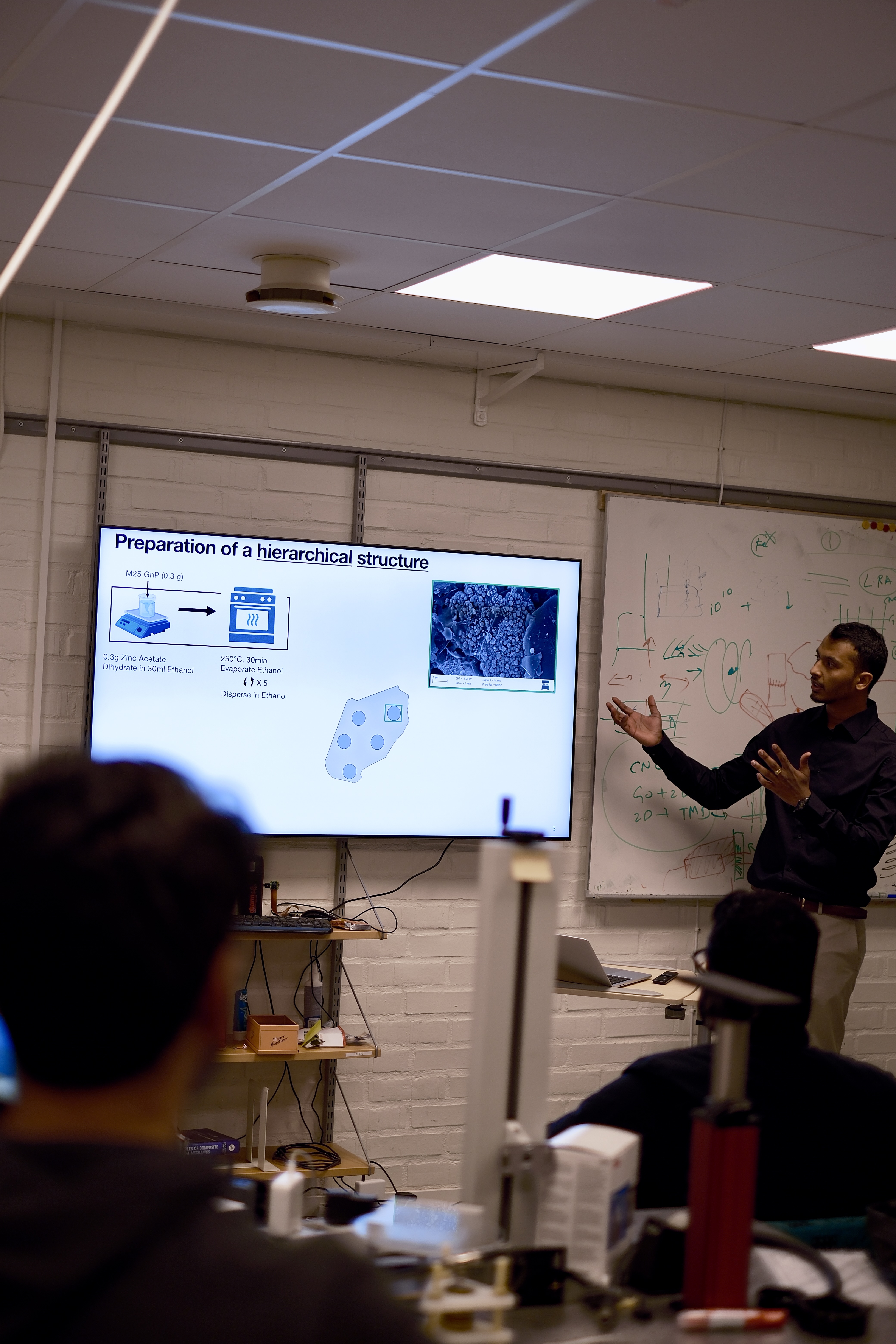 Manoj Chandregowda presenting his thesis in the lab